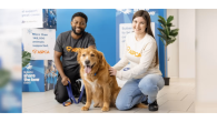 two people with a dog