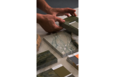 comparing paint swatches with marble material