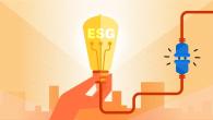 Abstract hand holding a lightbulb with ESG in it. A cord going from it to another plug.