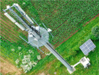 aerial view of cell tower in a field of crops