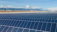 A vast open area filled with rows of solar panels.