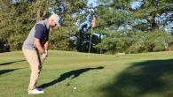 person golfing
