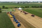 Aerial view of tractors and a tent