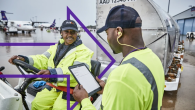 Two FedEx employees at work