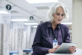 Doctor reading a tablet