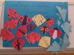 A paper poster with various handmade animals
