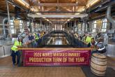 employees holding up award banner