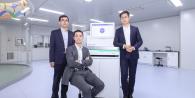 Illumina scientists in front of a computer screen.
