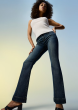 A model wearing jeans and a white shirt