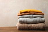folded sweaters on a table
