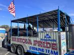 Cooking trailer with open sides and "Naheola Pride cooking team" on the side with Georgia-Pacific logo