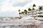 Stormy seas next to apartment buildings