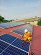 Man working on solar panels