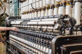 Thread on spools in a factory