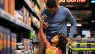 Father and child shopping in grocery store
