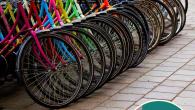 A row of bicycles parked at the street