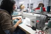 apparel factory worker at sewing machine