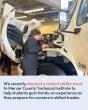 person examining truck engine