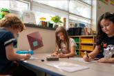 children learning in a classroom