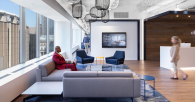 People inside office space with chairs and couches