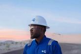person with a helmet on looking at the landscape