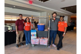 Volunteers with assembled pet adoption kits
