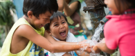 Kids playing in running water