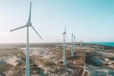 A row of wind turbines on desolate expanse of land