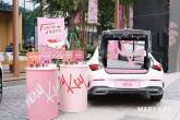 cosmetics display next to a car