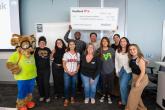 KeyBank and representatives from the Denver Scholarship Foundation shown with a check for $225,000.