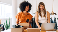 two people happily working together