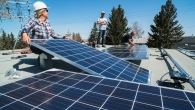  workers installing solar panels