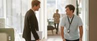 Two people having a discussion in an office.