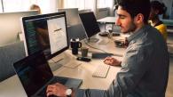 person coding at a computer