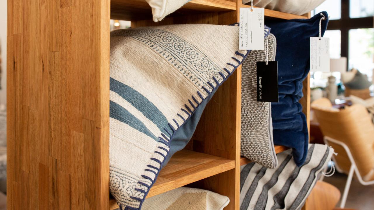 pillows on shelf in home furnishings store