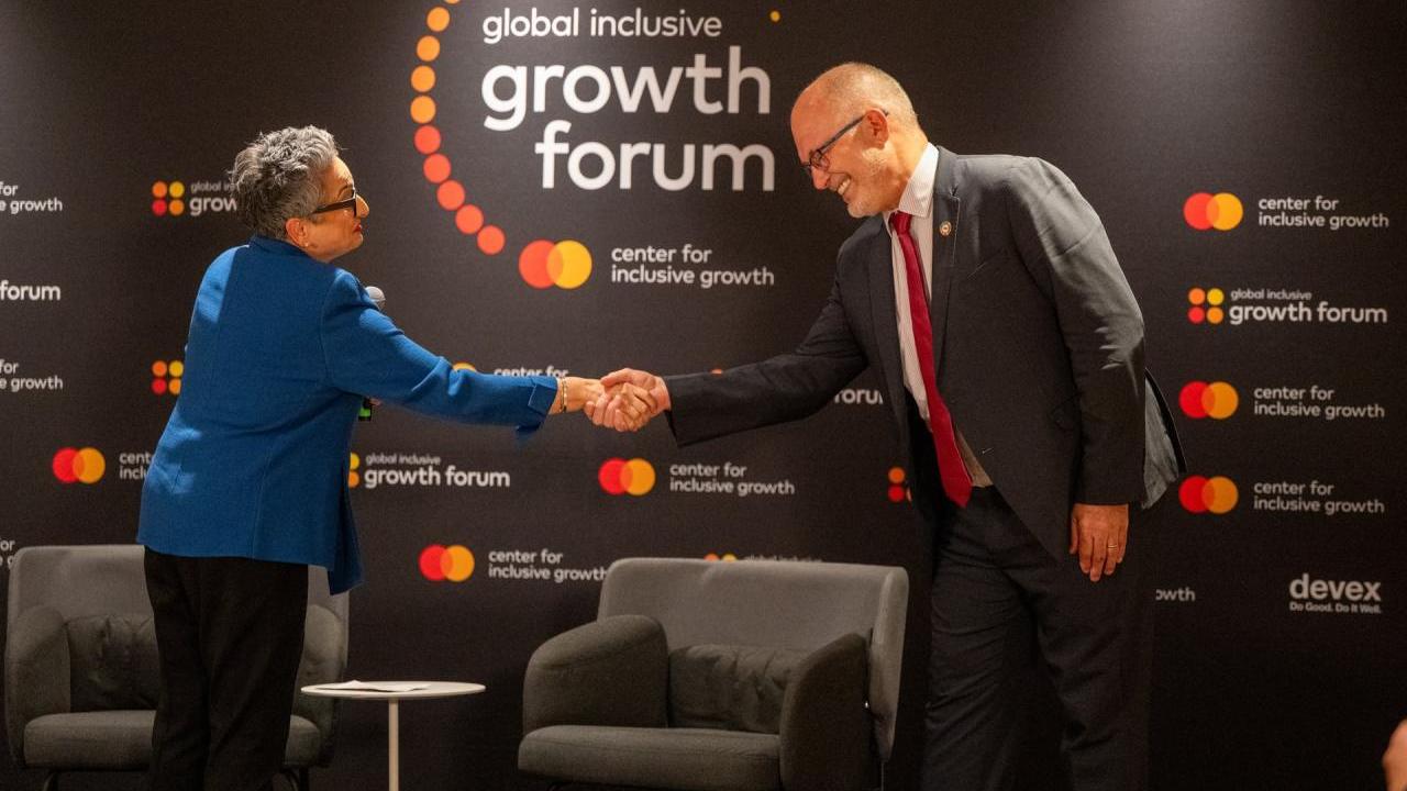 Woman and man shaking hands 