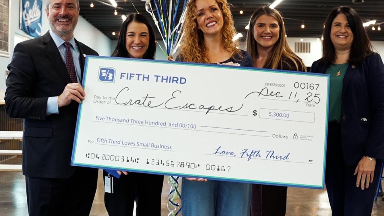 Crate Escapes Dog Park receiving grant check from Fifth Third