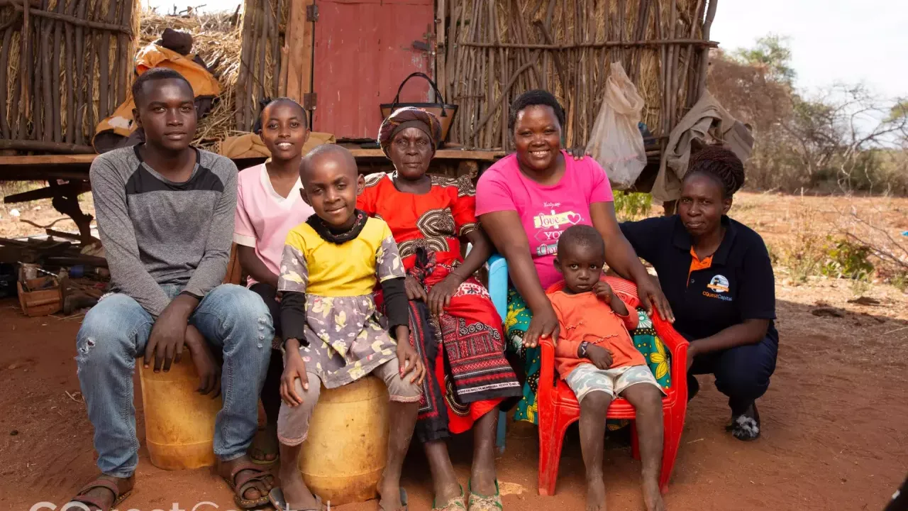 Joyce with her family and C-Quest Capital field officer. Image credits: C-Quest Capital