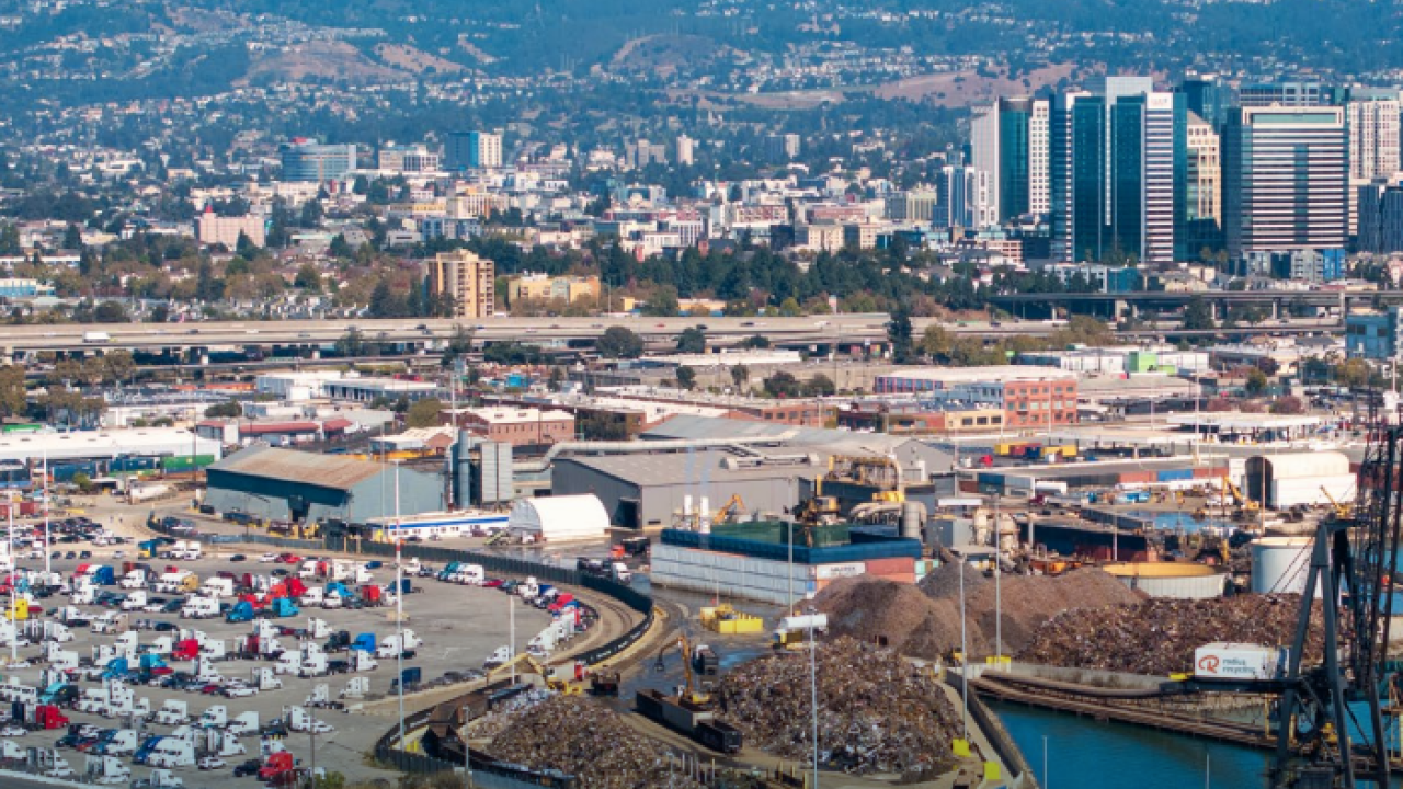 An aerial photo of a shipping yard and neighboring harbor
