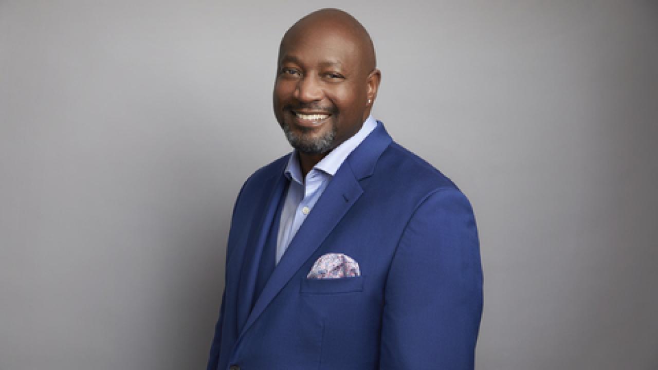 photo of David L Casey in a blue suit against a grey background