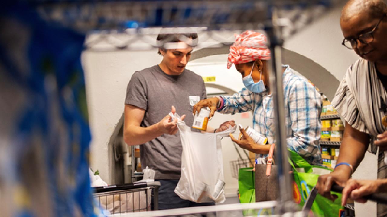 Someone picking up groceries at a food pantry