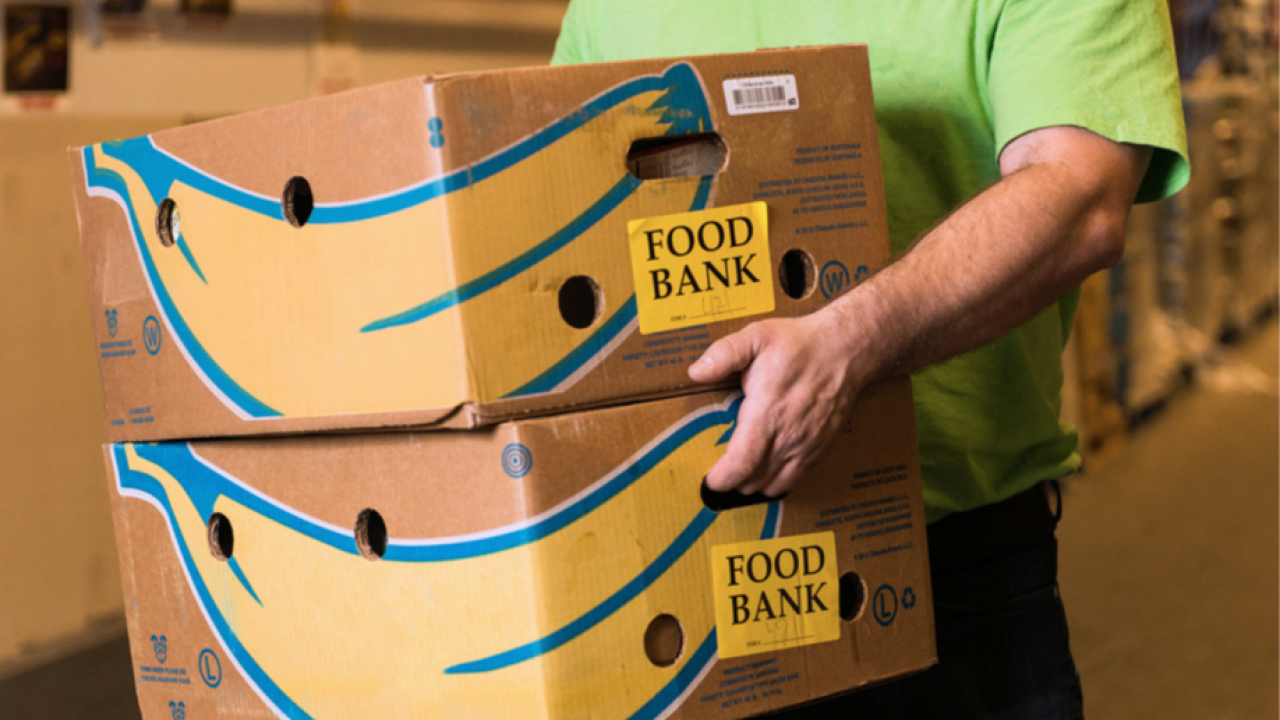 Person carrying two boxes