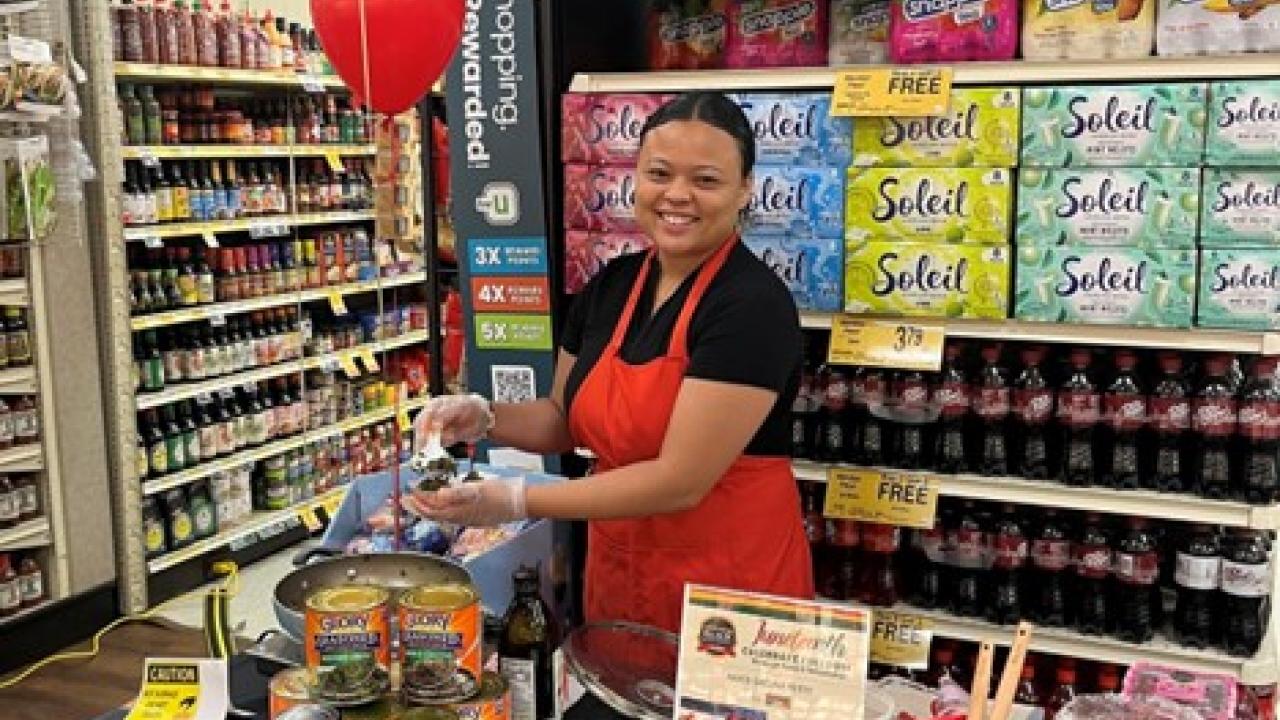 A person in an apron at a store