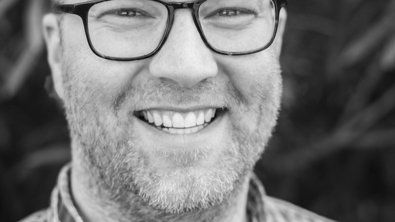 Black & white headshot of Logan Duran