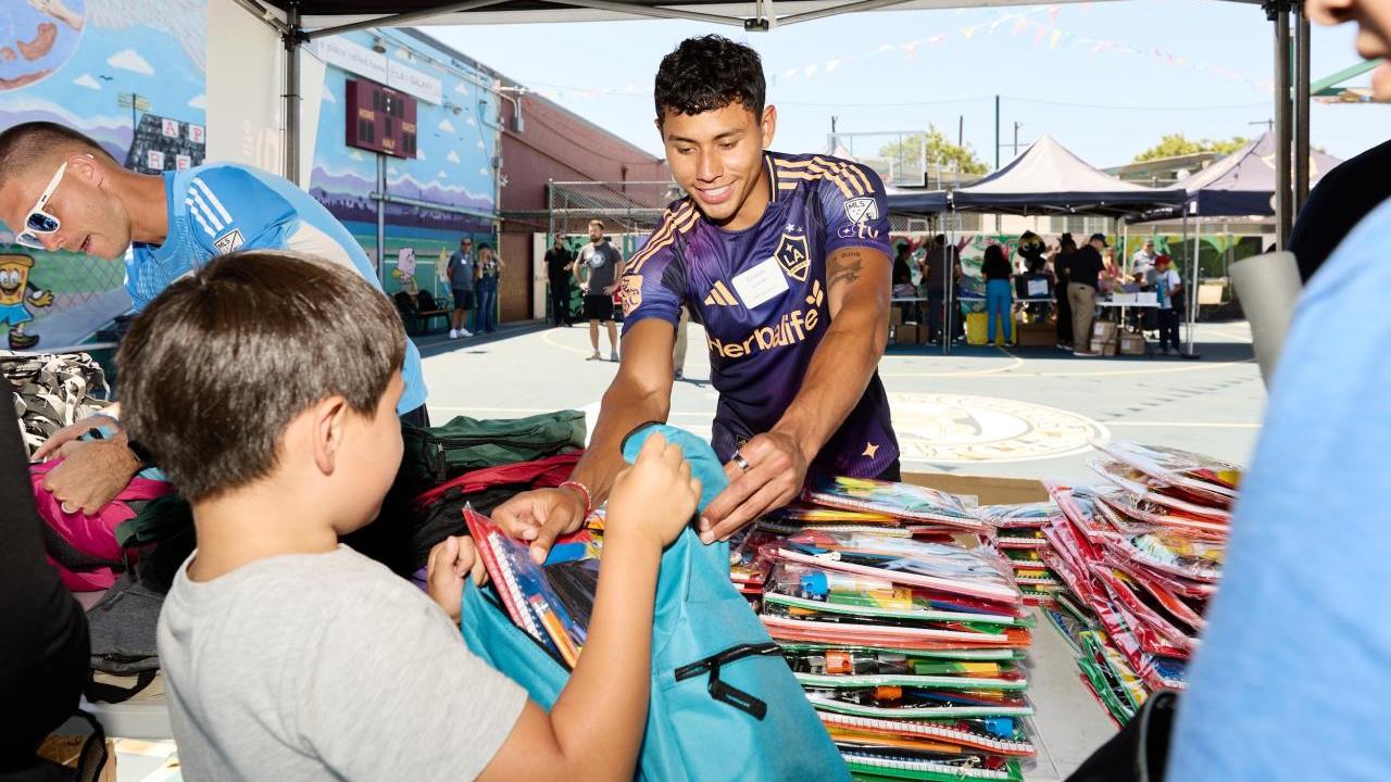 LA Galaxy midfielder Edwin Cerrillo helped hand out school supplies to students.