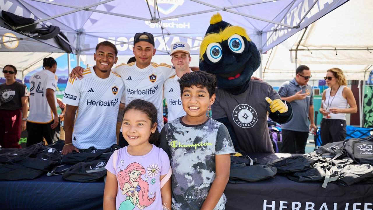 LA Galaxy players, staff and mascot Cozmo helped students in South LA get ready for the upcoming school year.