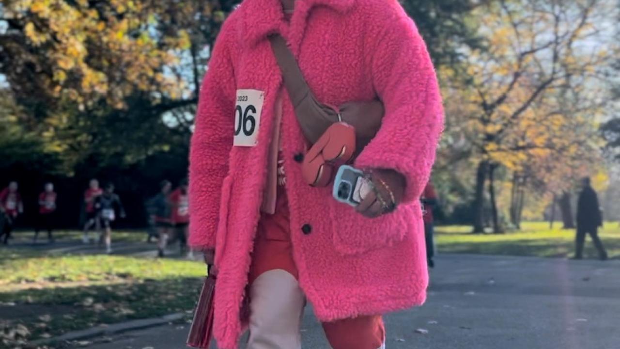 Person walking in bright pink coat
