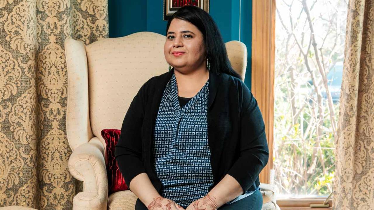 Syeda Ahmed sat on an arm chair 
