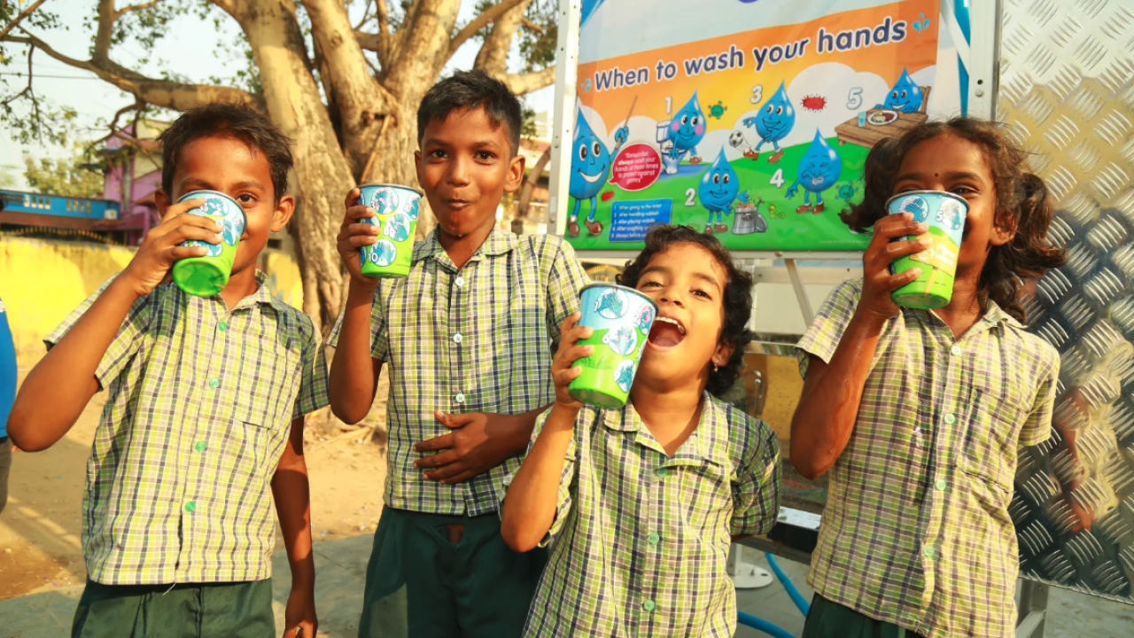 Kids drinking from colorful cups