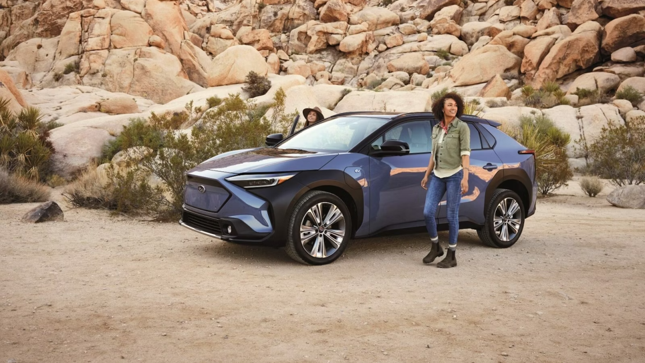 A person standing next to a car